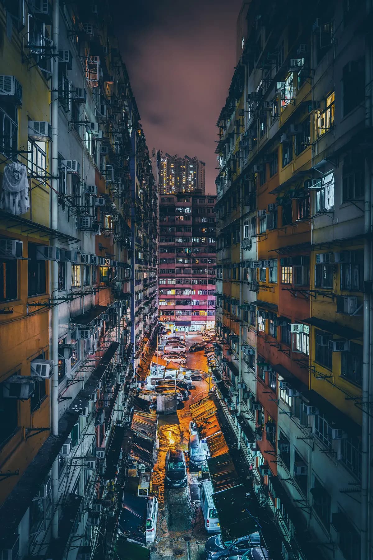 Busy street in Kowloon Hong Kong at night with neon lights