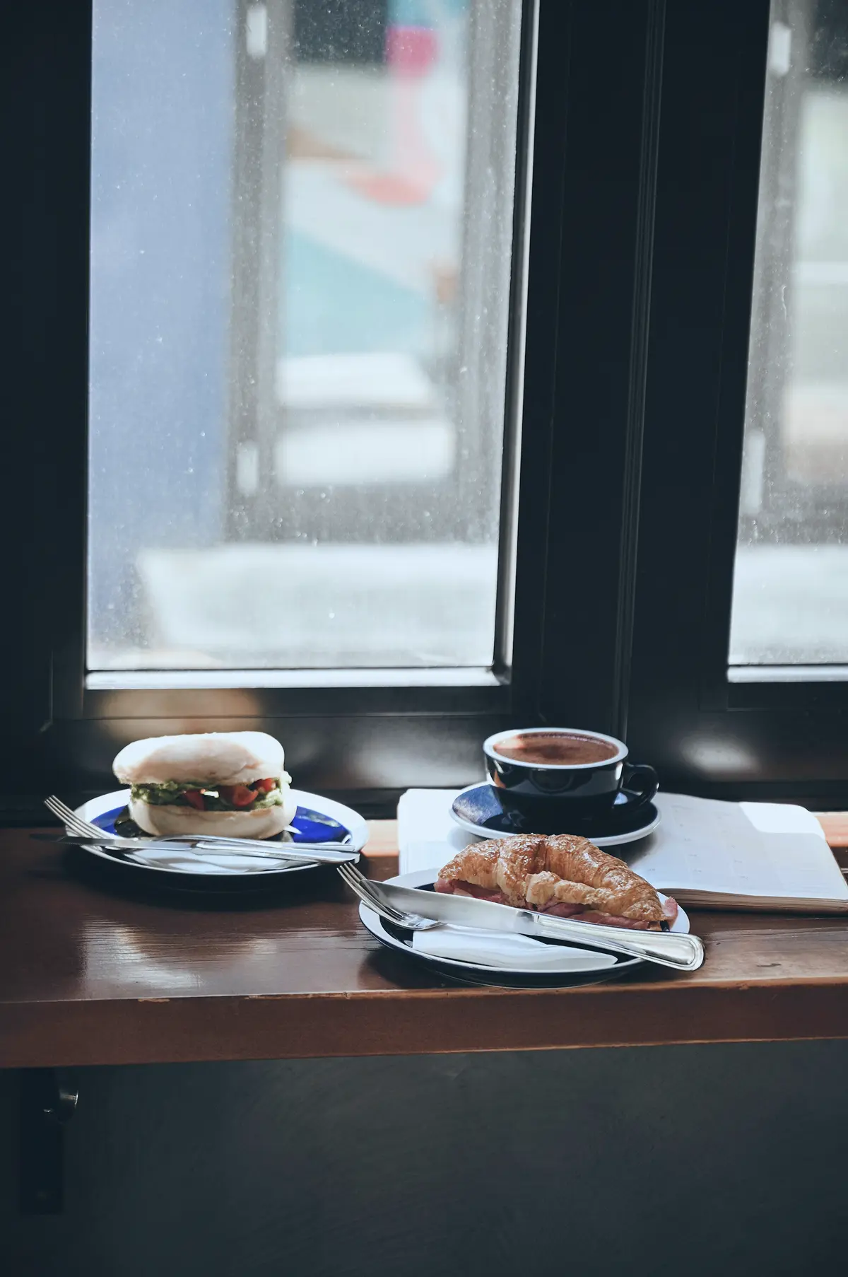 A specialty coffee shop in Sheung Wan with natural light pouring through the windows